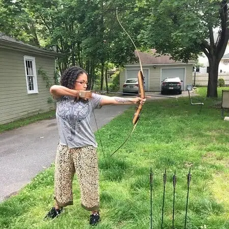 women shooting bow