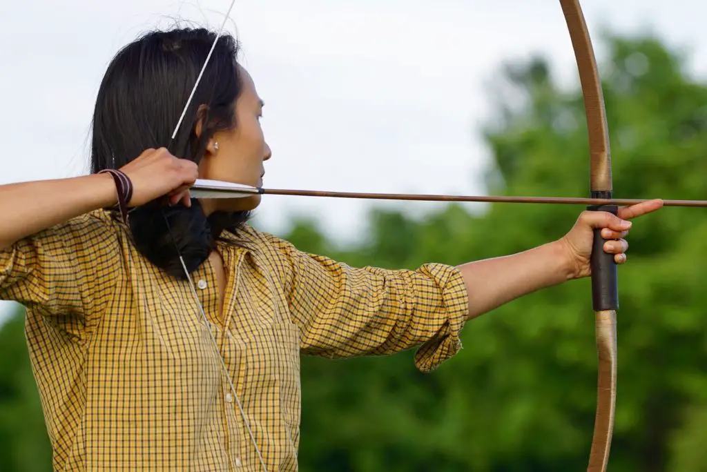 A wooden recurve bow can be used in many ways. 