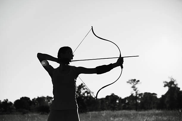 woman holding recurve bow