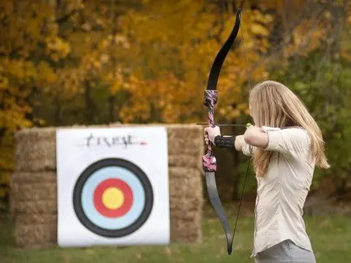 women shooting bow